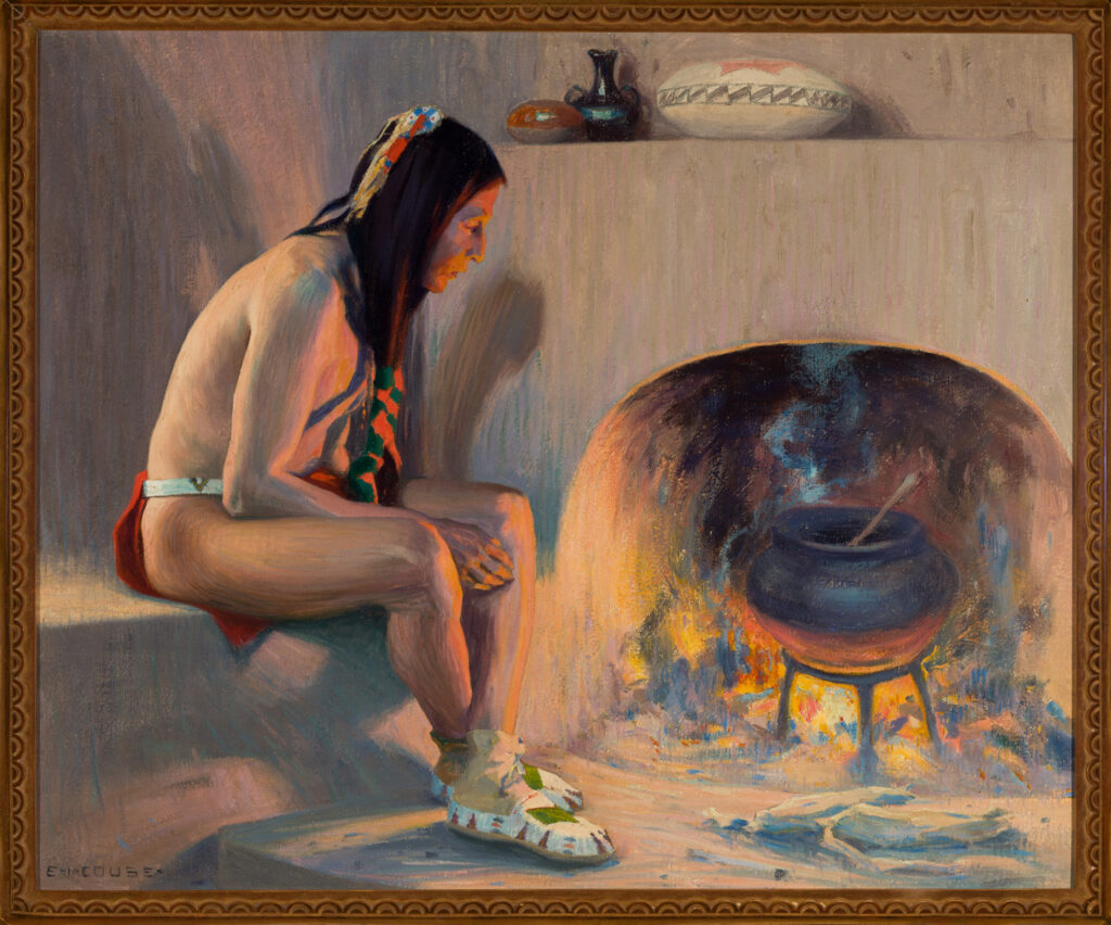 In the Early West Gallery, a person in traditional attire sits by a fireplace, watching a pot cook over an open flame inside an adobe structure. Various pottery is displayed on a shelf above.