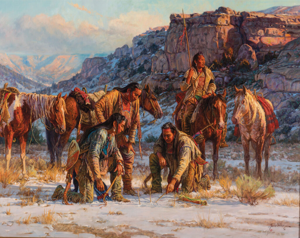 Four Native American men study tracks in the snow while three horses stand nearby; rocky cliffs and mountains form a dramatic backdrop in this evocative scene from the Native Life Gallery.