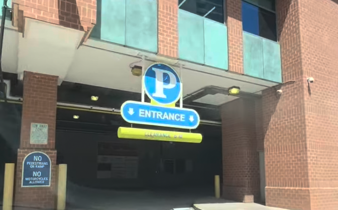 Parking garage entrance with a blue 