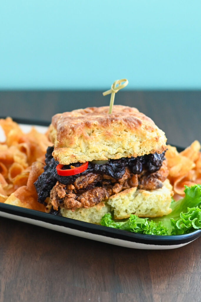 Chicken and biscuit sandwich with berry jam.